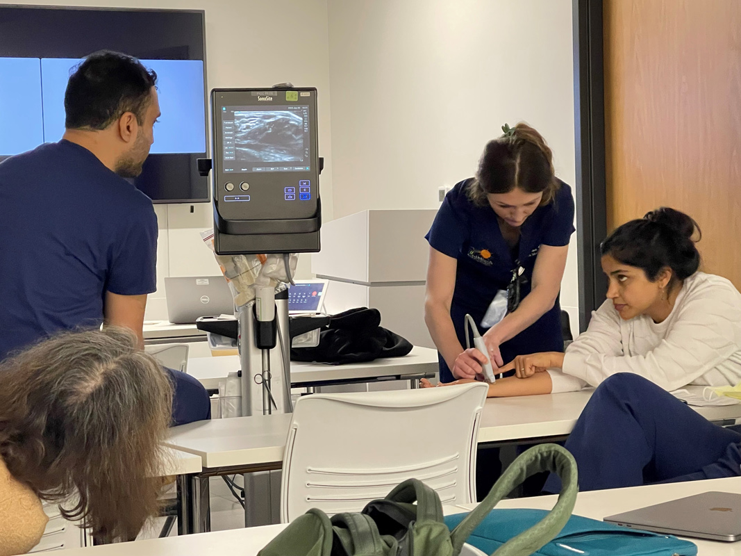 Three doctors reviewing a sonogram.